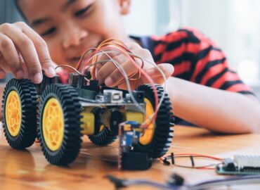 Pupils In Science Lesson Studying Robotics.